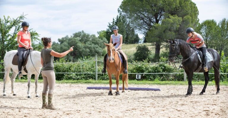 Horse-riding instructor demonstrating a lesson exercise with a student