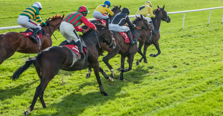 Racehorses sprinting toward the finish line